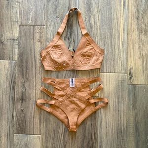 Nude 2 piece swimsuit with rhinestones. 90% polyester 10%spandex size M
